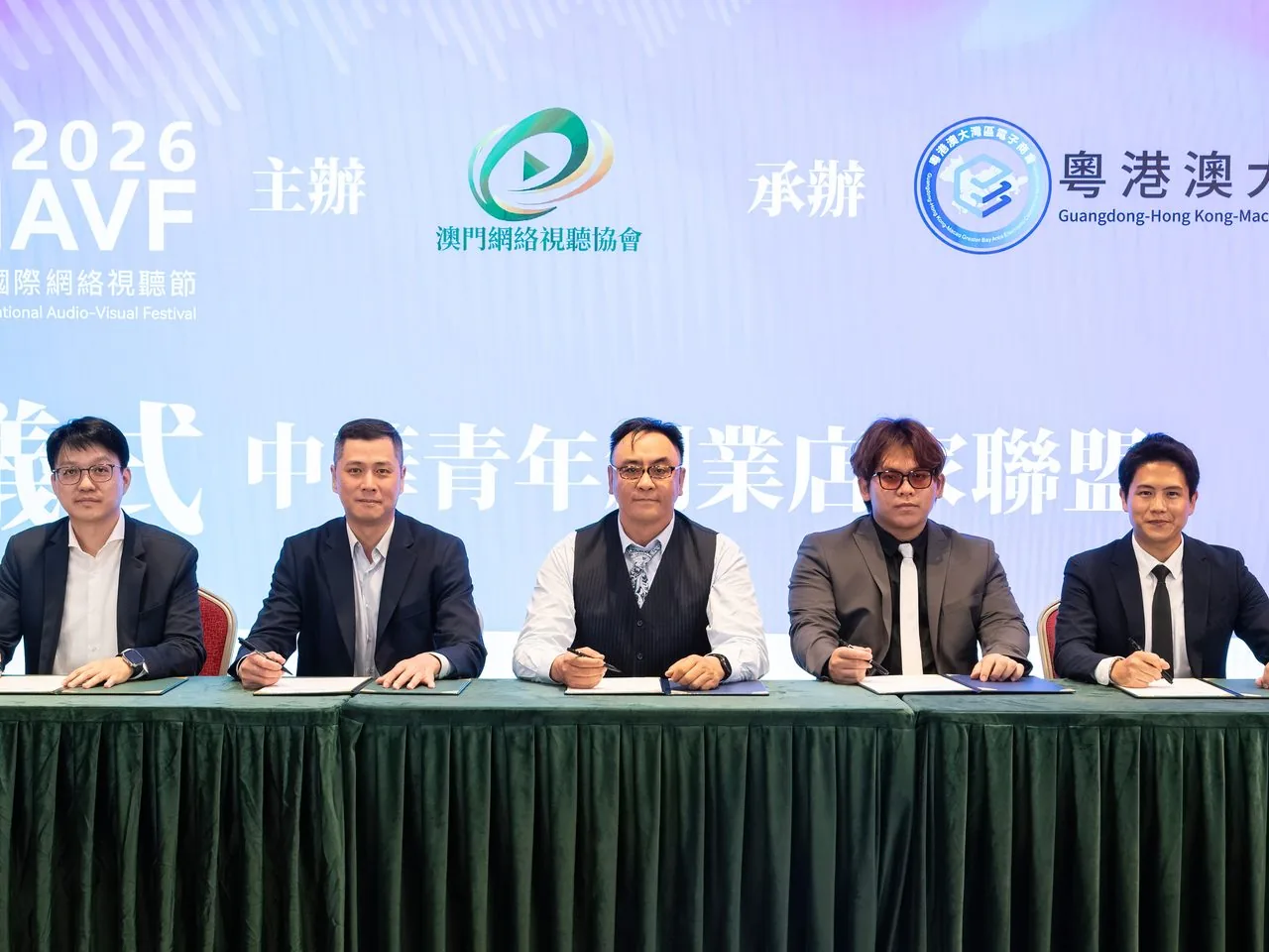 Five partners at the signing table for the Greater Bay Area Youth Entrepreneur-Merchant Alliance, Macao, 2 June 2026