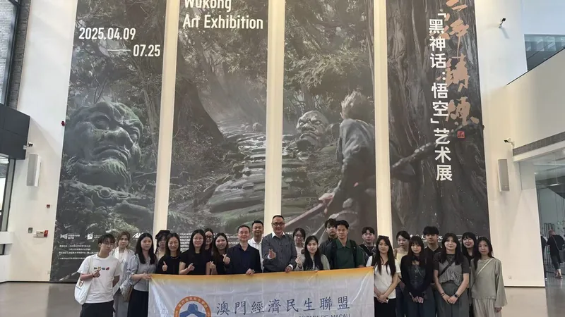 Delegation at the China Academy of Art 'Wukong Art Exhibition' atrium with full-scale banner photography